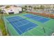 Community amenities include a tennis and basketball court with views of the canal and neighborhood homes at 8707 Sailmaker Ct, Tampa, FL 33615