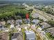 Aerial view showing backyard pool, easy highway access and a community pond at 8833 Bel Meadow Way, Trinity, FL 34655