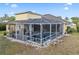 Aerial view of a screened-in pool and patio area at 8833 Bel Meadow Way, Trinity, FL 34655
