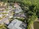 Residential aerial view highlighting backyard privacy, screened pool, patio and fire pit area at 8833 Bel Meadow Way, Trinity, FL 34655