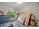 Cluttered bedroom with a view of the backyard and fresh paint at 8833 Bel Meadow Way, Trinity, FL 34655