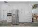 Modern kitchen with stainless steel appliances and built in white storage cabinets at 8833 Bel Meadow Way, Trinity, FL 34655