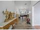 Grand living room with piano, stylish light fixture, and access to the patio at 8833 Bel Meadow Way, Trinity, FL 34655
