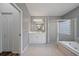 Bright bathroom with walk-in shower and tub combo at 8833 Bel Meadow Way, Trinity, FL 34655