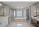 Spa-like main bathroom with soaking tub and separate shower at 8833 Bel Meadow Way, Trinity, FL 34655