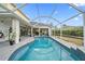 A screened-in pool featuring a lovely design with tiled accents and an open outdoor space at 8833 Bel Meadow Way, Trinity, FL 34655