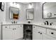 Modern bathroom with double sinks, vanity, and stylish mirrors at 10 Arbor Ln, Oldsmar, FL 34677