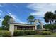 Stone sign for East Lake Woodlands, showcasing the community's entrance and landscaping at 10 Arbor Ln, Oldsmar, FL 34677