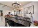 Beautiful dining area with a modern chandelier and open layout at 10 Arbor Ln, Oldsmar, FL 34677