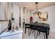 Elegant dining room with a modern chandelier and stylish decor at 10 Arbor Ln, Oldsmar, FL 34677