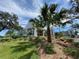 Beautiful building with lush landscaping and palm trees, offering a tranquil and inviting atmosphere at 10 Arbor Ln, Oldsmar, FL 34677
