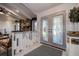 Bright foyer featuring a decorative glass door, white banister and decorative accents at 10 Arbor Ln, Oldsmar, FL 34677