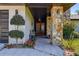 Inviting front entrance featuring a stone column and well maintained landscaping at 10 Arbor Ln, Oldsmar, FL 34677