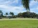 Expansive green golf course with golf carts, ideal for leisurely afternoons in a serene setting at 10 Arbor Ln, Oldsmar, FL 34677