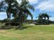 Scenic golf course with lush green fairways and mature trees, perfect for a relaxing round of golf at 10 Arbor Ln, Oldsmar, FL 34677