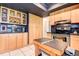 Bright kitchen boasts wooden cabinets, dark countertops and stainless steel appliances at 10 Arbor Ln, Oldsmar, FL 34677