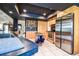 Well-lit kitchen showcases stainless steel appliances, wooden cabinets, dark countertops and tile flooring at 10 Arbor Ln, Oldsmar, FL 34677