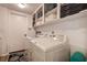 Functional laundry room with washer, dryer, and ample storage at 10 Arbor Ln, Oldsmar, FL 34677
