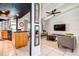 Charming living room showcasing an open layout into a modern kitchen at 10 Arbor Ln, Oldsmar, FL 34677