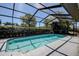 This inviting screened-in pool offers privacy and enjoyment in a serene outdoor setting at 10 Arbor Ln, Oldsmar, FL 34677