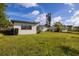 Backyard view of home showing the exterior features of the property and the surrounding greenery at 1032 26Th S Ave, St Petersburg, FL 33705