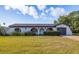 Charming single-story home featuring a stucco exterior, arched entryway, and well-manicured landscaping at 1032 26Th S Ave, St Petersburg, FL 33705