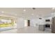 Open concept living room boasts sliding glass doors and stainless steel kitchen at 1032 26Th S Ave, St Petersburg, FL 33705