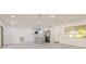 Open-concept living room and kitchen with stainless steel appliances and gray island at 1032 26Th S Ave, St Petersburg, FL 33705