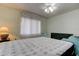 Bright bedroom with natural light, featuring a large bed and a classic dresser at 10514 52Nd N Ave, St Petersburg, FL 33708