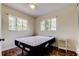 Sunny bedroom with parquet floors and tree views from the double windows at 10514 52Nd N Ave, St Petersburg, FL 33708