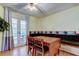 Dining room with a vintage table and bench seating adjacent to French doors at 10514 52Nd N Ave, St Petersburg, FL 33708