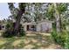 Charming single-story home with lush landscaping and mature trees in a quiet neighborhood at 10514 52Nd N Ave, St Petersburg, FL 33708