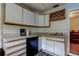 Functional kitchen space with clean cabinetry and modern appliances, complemented by natural light and a sink area at 10514 52Nd N Ave, St Petersburg, FL 33708