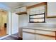 Cozy kitchen featuring white cabinets and a window, offering a blend of functionality and natural lighting at 10514 52Nd N Ave, St Petersburg, FL 33708