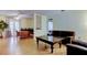 Bright and airy living room featuring hardwood floors and French doors to a porch at 10514 52Nd N Ave, St Petersburg, FL 33708