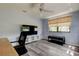 Inviting living room showcasing a TV, stylish flooring, and natural light, ideal for relaxation and entertainment at 10514 52Nd N Ave, St Petersburg, FL 33708