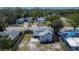 Aerial view shows a home with a large fenced in backyard and proximity to other neighborhood houses at 1138 Howard St, Clearwater, FL 33756