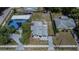 An aerial shot of the property showcasing the layout, landscaping, and surrounding neighborhood at 1138 Howard St, Clearwater, FL 33756