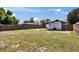 View of backyard with large lawn and fenced perimeter at 1138 Howard St, Clearwater, FL 33756