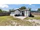 Spacious backyard, white rock patio area with seating, and well-maintained lawn at 1138 Howard St, Clearwater, FL 33756