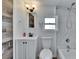 Renovated bathroom features custom tilework and modern fixtures at 1138 Howard St, Clearwater, FL 33756