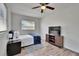 Bright bedroom features natural light, ceiling fan, and hardwood flooring at 1138 Howard St, Clearwater, FL 33756