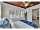 Bright bedroom featuring a decorative ceiling fan, wood ceiling, and natural light from multiple windows at 1138 Howard St, Clearwater, FL 33756