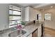 Bright kitchen featuring granite countertops, stainless steel appliances, and a new sink at 1138 Howard St, Clearwater, FL 33756