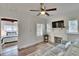 View of the comfortable living room leading to the bedroom, featuring a decorative fireplace at 1138 Howard St, Clearwater, FL 33756