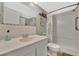 Well-maintained bathroom featuring a walk-in shower, vanity, and neutral color scheme at 128 E Saint Johns Way, Apollo Beach, FL 33572