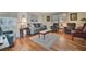 Cozy living room with hardwood floors and neutral-toned furniture, perfect for relaxing and entertaining at 128 E Saint Johns Way, Apollo Beach, FL 33572