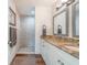 Updated bathroom featuring granite counters, updated vanity, and a stand-up shower at 1313 E Cayuga St, Tampa, FL 33603