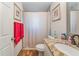 Updated bathroom with granite counters, tile floor, and neutral paint at 1313 E Cayuga St, Tampa, FL 33603