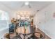Open dining area featuring a round table and views into the modern, eat-in kitchen at 1313 E Cayuga St, Tampa, FL 33603